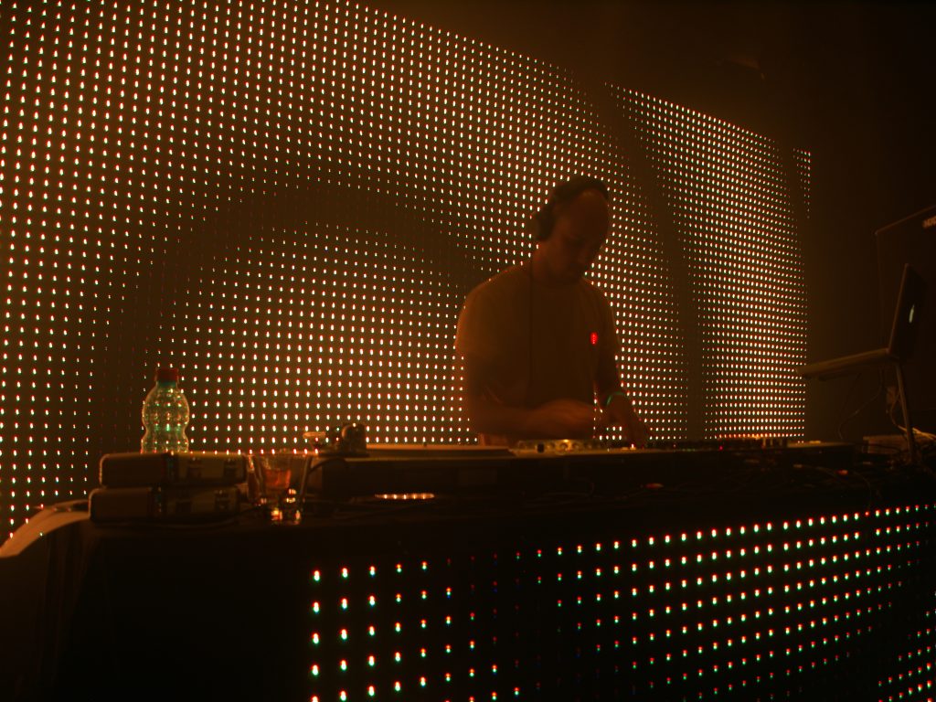 Tel Aviv's Hottest Clubs, Galleries, and Pop-Up Shops 1 LED screen behind Tsach Zimroni in Tel Aviv Israel1