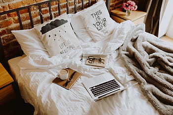 Upgrade Your Sheets and Make Your Bed the Coziest Place on Earth 2 home office bed office bed bedding royalty free thumbnail1