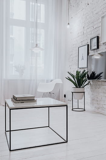 5 Stylish Tables That Show Off Some Leg 1 minimal room coffee table white royalty free thumbnail1